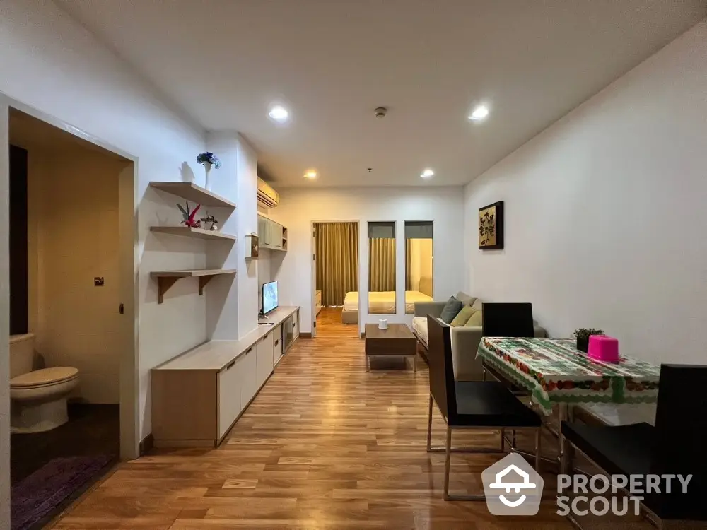 Modern studio apartment with open layout, cozy living area, and stylish decor.