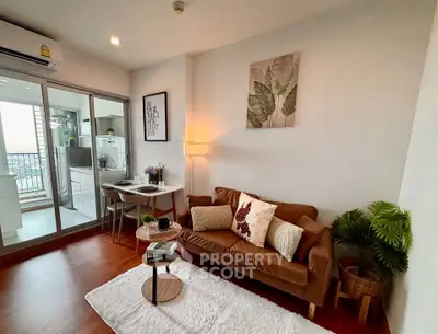 Cozy living room with modern decor and open kitchen layout, perfect for urban living.