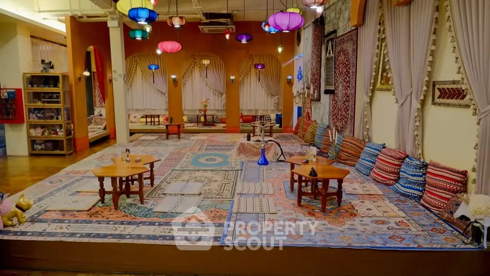 Luxurious living room with vibrant decor and plush seating, perfect for relaxation and entertainment.