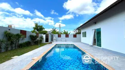 Stunning modern home with private pool and lush garden, perfect for luxury living.