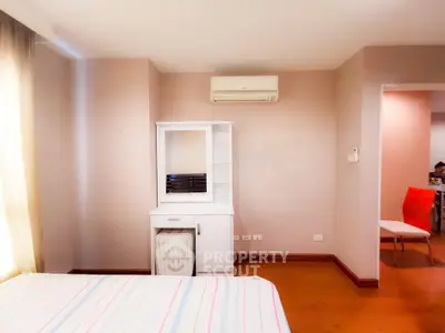 Spacious bedroom with air conditioning and modern furniture in a cozy apartment.