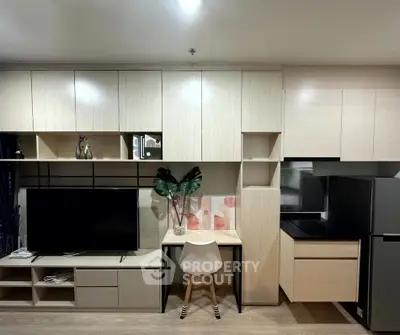 Modern living room with sleek cabinetry and integrated workspace