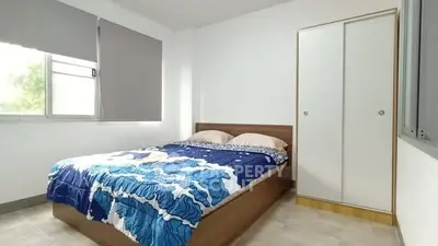 Cozy bedroom with modern design and ample natural light