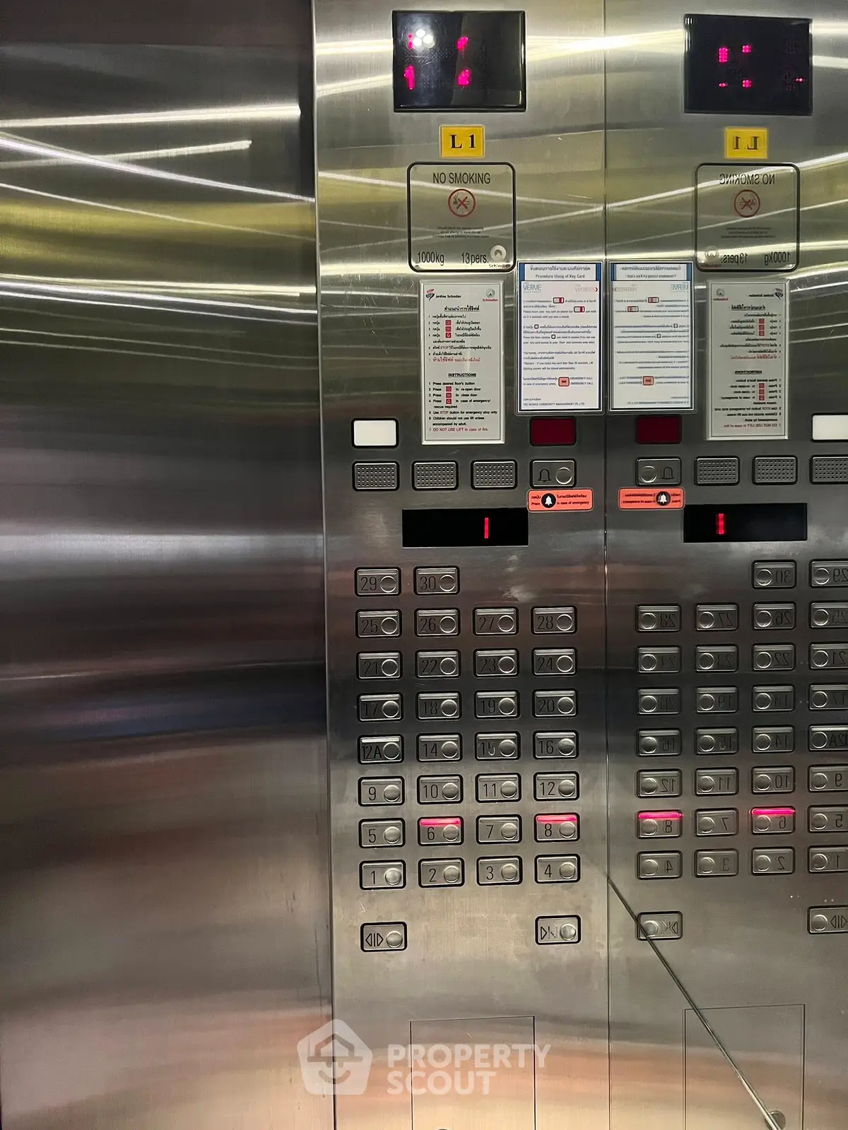 Modern elevator interior with stainless steel panels and control buttons