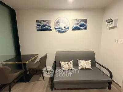 Modern living room with stylish decor and compact furniture