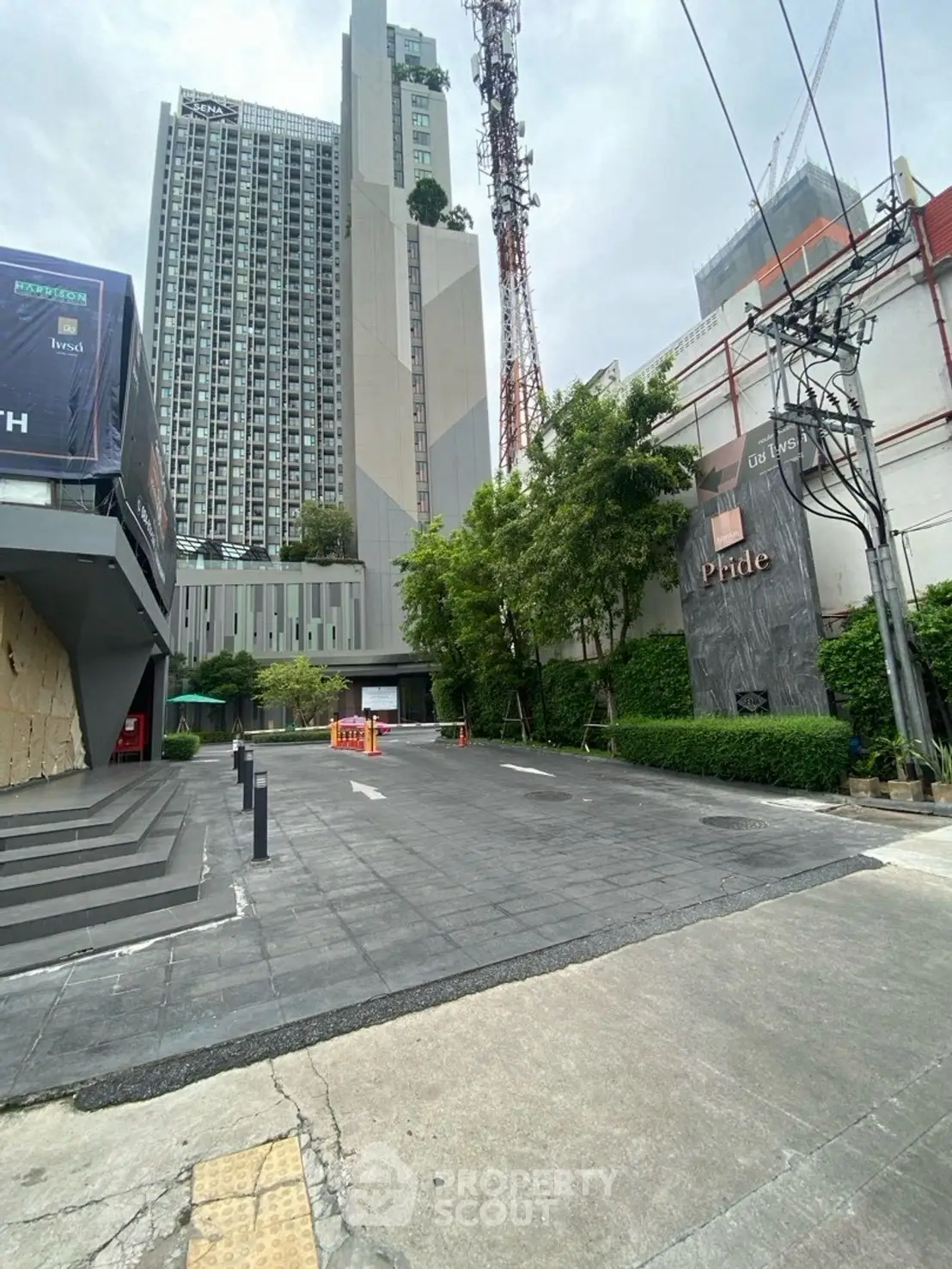 Modern urban building exterior with sleek design and lush greenery