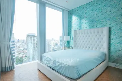 Luxurious bedroom with stunning city view and elegant decor