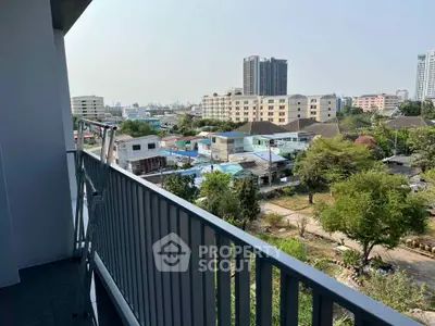 Spacious balcony with cityscape view in modern apartment building