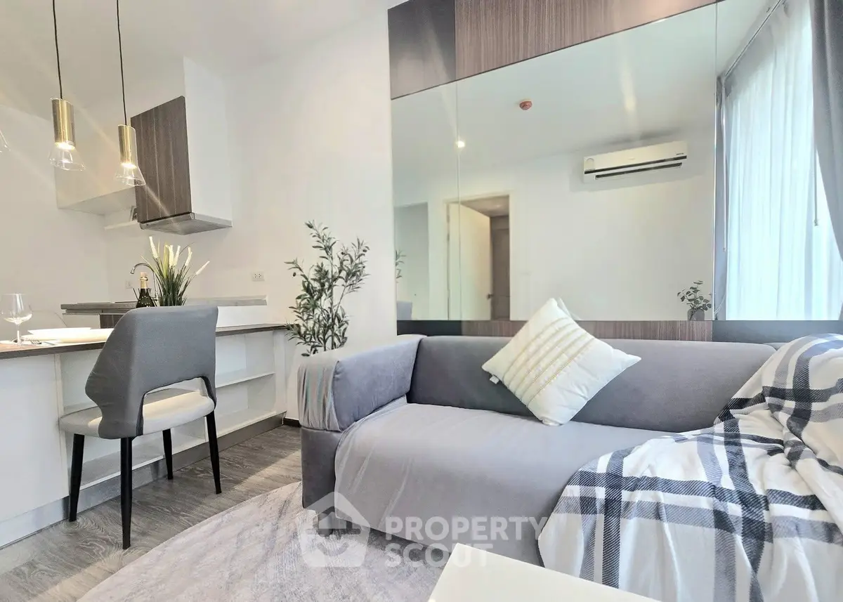 Modern living room with stylish decor and open kitchen layout