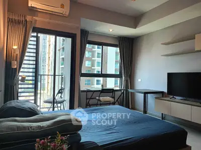 Modern bedroom with balcony view in urban apartment