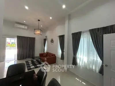 Spacious modern living room with elegant decor and ample natural light