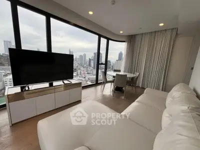 Luxurious living room with panoramic city views and modern furnishings