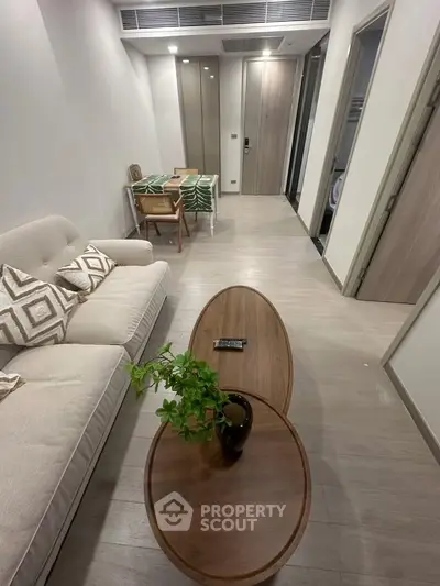 Modern living room with stylish furniture and elegant decor in a contemporary apartment.