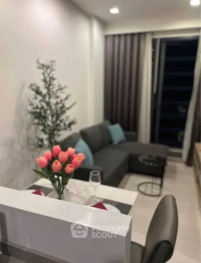 Modern living room with stylish decor and cozy seating area, perfect for relaxation and entertaining.