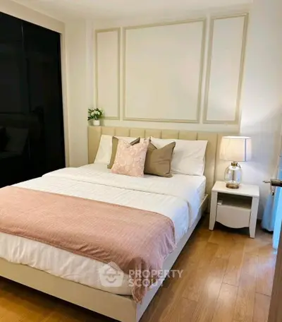 Cozy bedroom with elegant decor and soft lighting, perfect for relaxation.