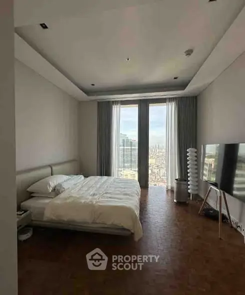 Luxurious bedroom with stunning city view and modern decor