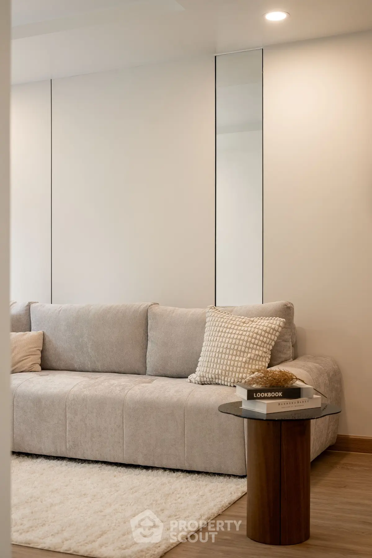 Modern living room with plush sofa and stylish decor, perfect for relaxation and comfort.