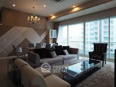 Luxurious modern living room with elegant decor and city view balcony.