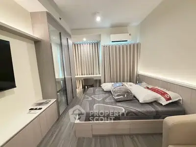 Modern bedroom with sleek design, featuring a cozy bed, built-in wardrobe, and ambient lighting.