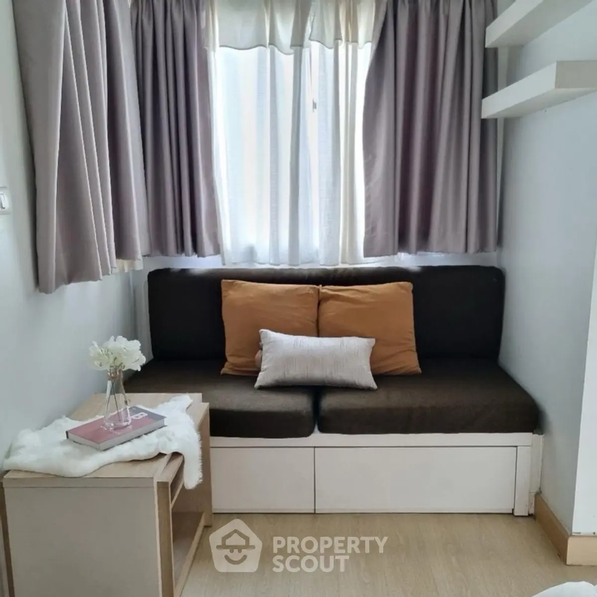 Cozy small living room with modern decor and natural light