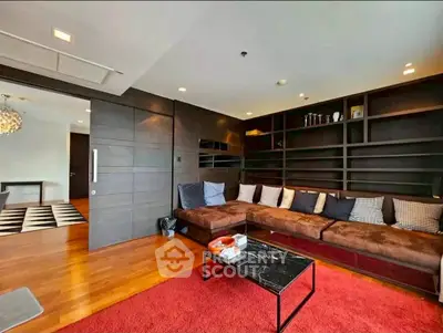 Luxurious living room with modern design, spacious seating, and elegant decor in a high-end apartment.