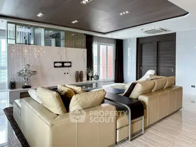 Luxurious modern living room with leather sofas and elegant decor