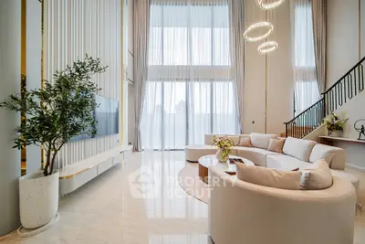 Luxurious modern living room with high ceilings and elegant decor