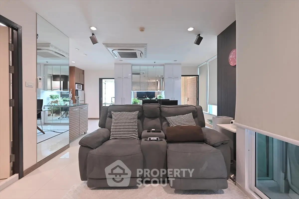 Modern living room with plush sofa and stylish decor in a contemporary apartment.