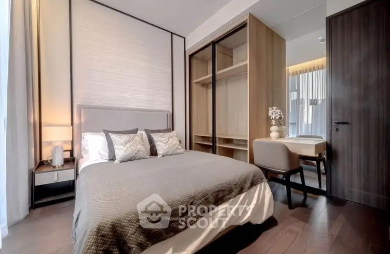 Modern bedroom with stylish decor and spacious wardrobe in a luxury apartment.