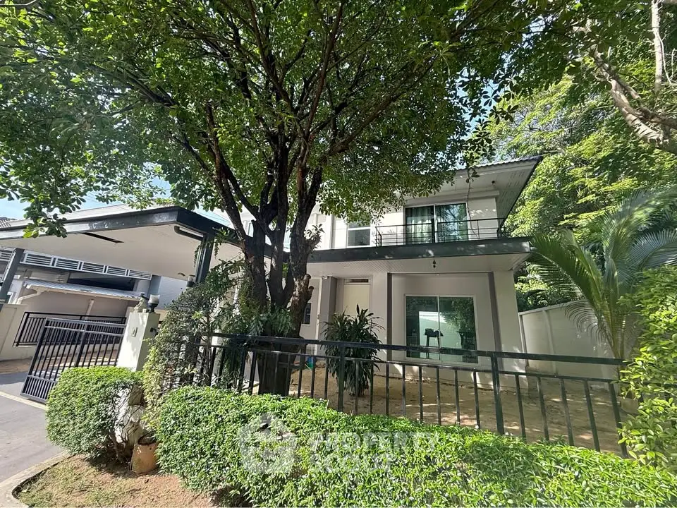Charming two-story house with lush garden and spacious balcony, perfect for serene living.
