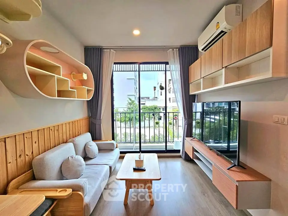Modern living room with stylish furniture and balcony view