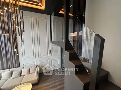 Luxurious modern living room with elegant staircase and chic lighting