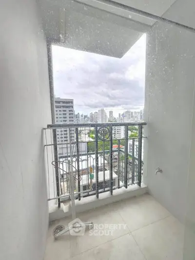 High-rise balcony with stunning city view, perfect for urban living.