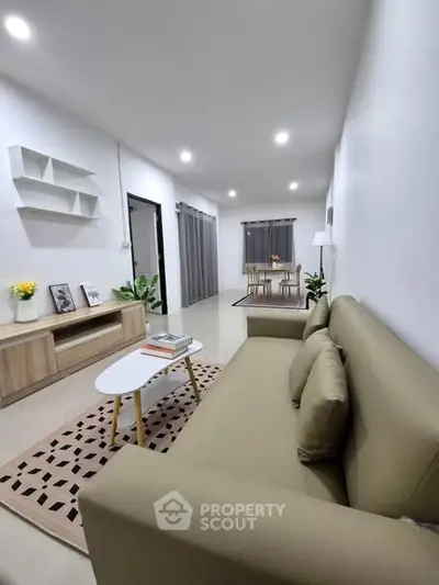 Modern living room with stylish decor and comfortable seating in a spacious layout.