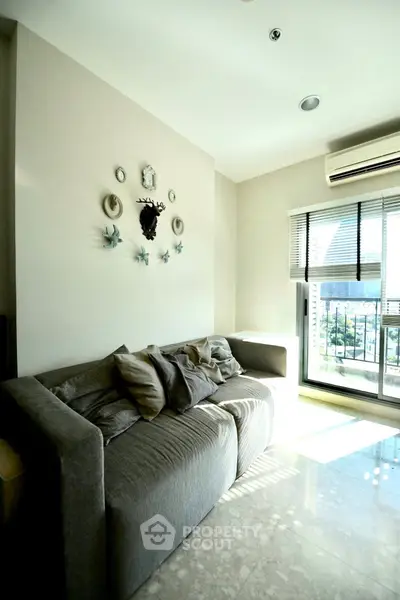 Bright living room with modern decor and large window view