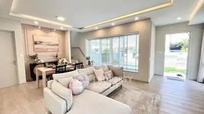 Spacious modern living room with elegant decor and large windows