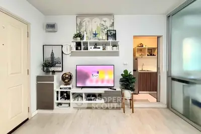 Modern living room with stylish decor and open kitchen layout