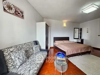 Spacious studio apartment with modern furnishings and cozy ambiance