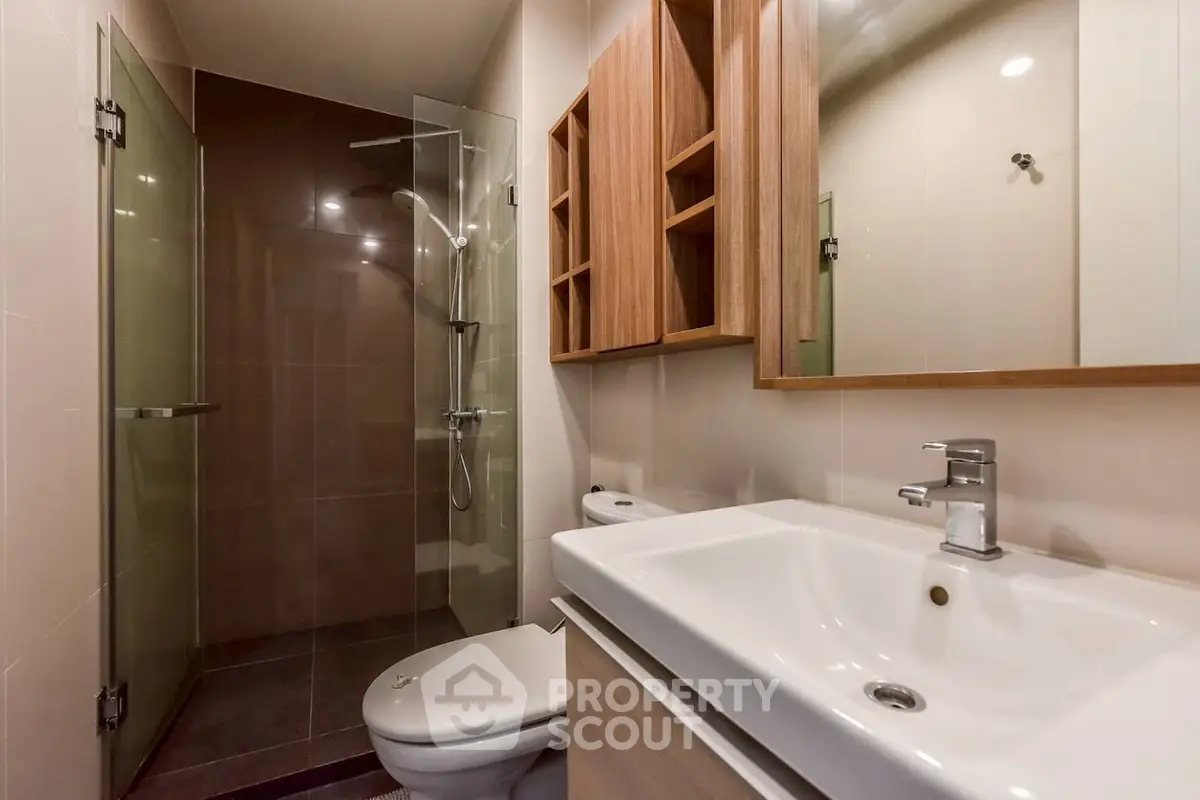 Modern bathroom with glass shower and sleek fixtures