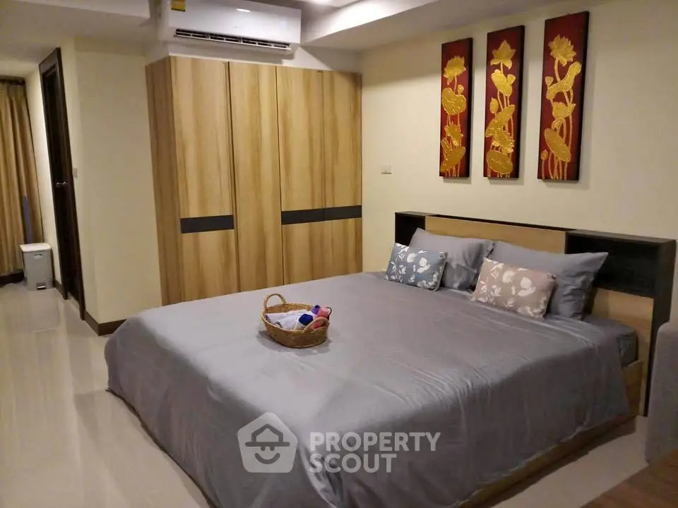 Spacious bedroom with modern decor and cozy ambiance