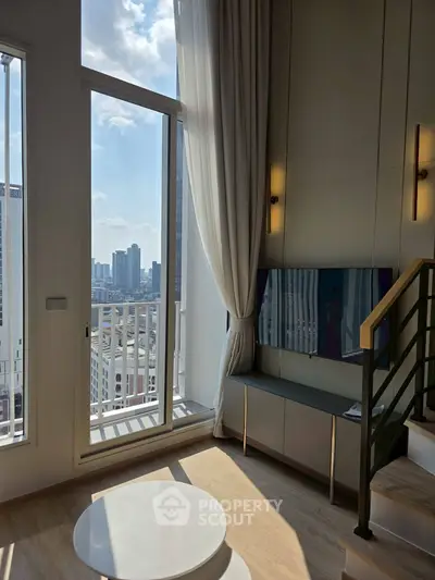 Modern living room with floor-to-ceiling windows and city view