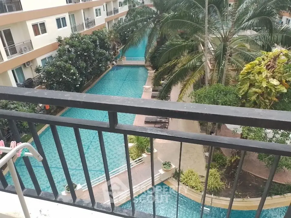 Stunning pool view from balcony in modern apartment complex