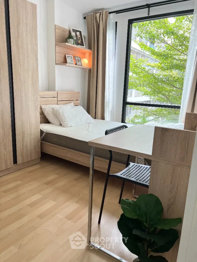 Cozy bedroom with natural light and modern wooden furniture