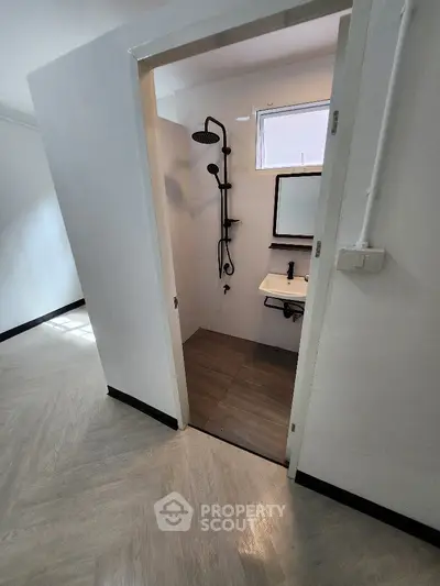 Compact bathroom with modern fixtures and minimalist design
