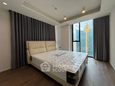 Luxurious bedroom with city view, featuring a plush bed and floor-to-ceiling windows in a modern high-rise.