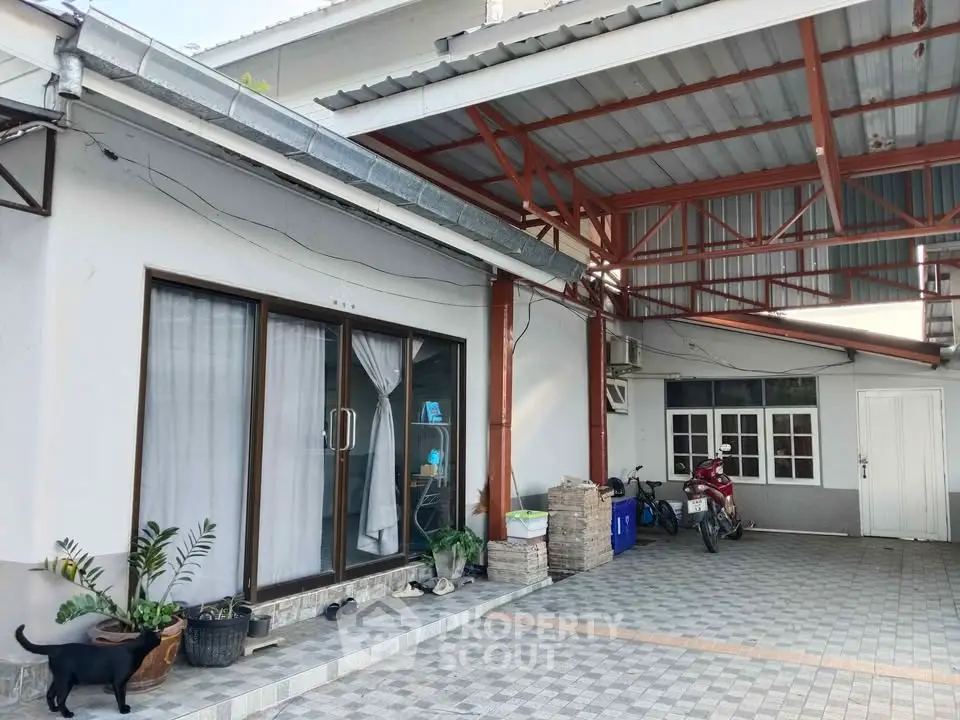 Spacious residential property with covered parking and modern exterior design.