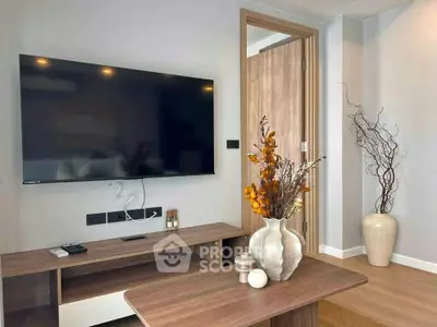 Modern living room with wall-mounted TV and stylish decor
