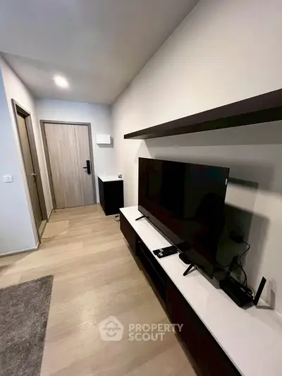 Modern living room with sleek TV setup and minimalist decor