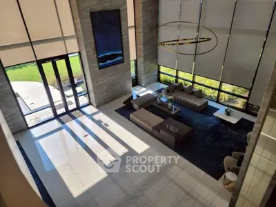 Luxurious modern living room with high ceilings and elegant decor