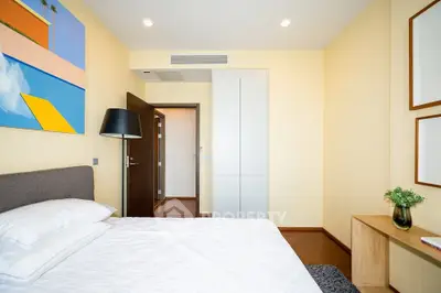 Modern bedroom with minimalist decor and bright lighting